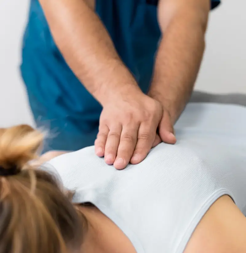 Osteopathy - A woman receiving a back massage
